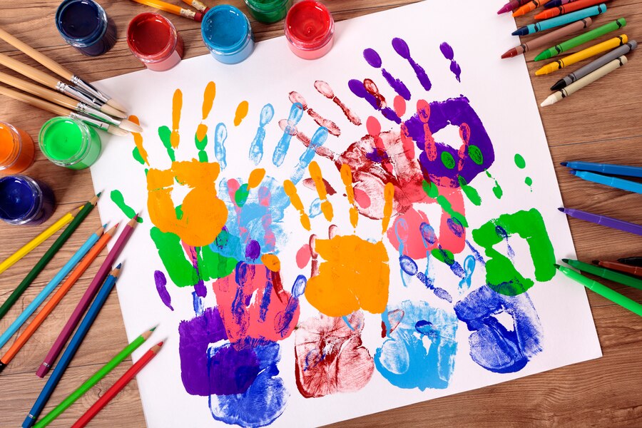 57225painted-handprints-with-artistic-equipment_1101-351.jpg